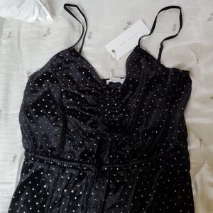 Black and gold polka dotted pantsuit